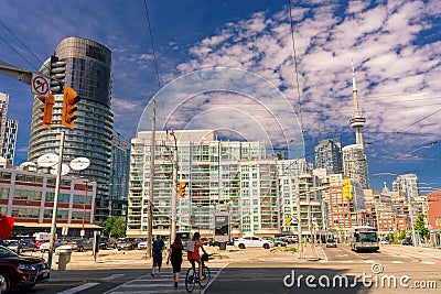 Amazing, inviting view of Toronto down town area with modern stylish buildings, cars bus and people walking through the streets Editorial Stock Photo