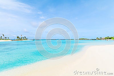 Amazing island in the Maldives ,Beautiful turquoise waters and white sandy beach with blue sky background Stock Photo