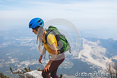 Amazing landscape with a mountain range and a tourist with a backpack in the foreground. mountaineering and climbing Stock Photo