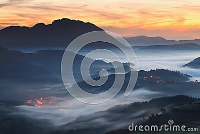 Amazing misty sunrise over Aramaio Valley Stock Photo