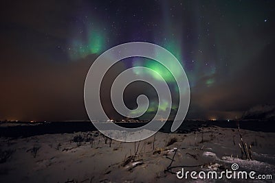 Amazing multicolored Aurora Borealis also know as Northern Lights in the night sky over Lofoten landscape, Norway, Scandinavia. Stock Photo