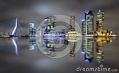Amazing night reflection of Erasmus bridge and several skyscrapers in Rotterdam, Holland. Editorial Stock Photo