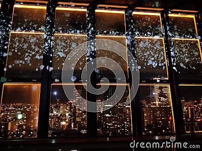 Amazing night view from the tower when seeing through the window Stock Photo