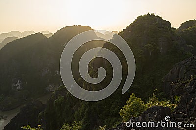 Amazing panorama view of limestone rocks and mountaintops from Hang Mua Temple at evening. Ninh Binh, Vietnam. Travel landscapes Stock Photo