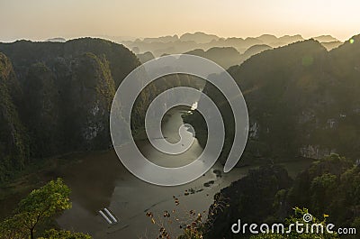 Amazing panorama view of limestone rocks and mountaintops from Hang Mua Temple at evening. Ninh Binh, Vietnam. Travel landscapes Stock Photo