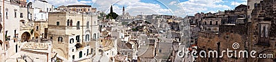 Amazing panoramic view from a balcony of typical stones Sassi di Matera and church of Matera UNESCO European Capital of Culture Stock Photo