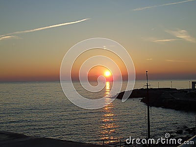 An amazing photography of the sunset over the sea Stock Photo