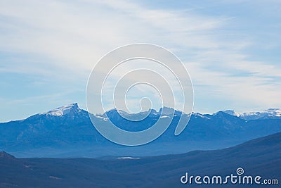 Amazing pictorial landscape of snow-covered mountains under boundless blue sky Stock Photo