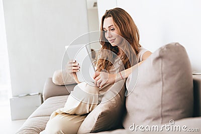Amazing pretty lady using tablet computer. Stock Photo