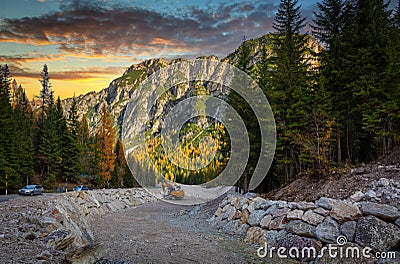 Amazing road through the Dolomites mountains at sunset, Italy Stock Photo