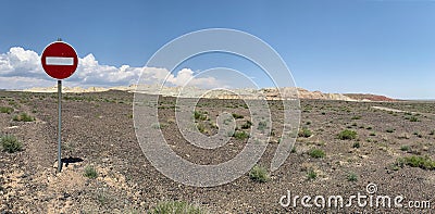 Amazing road sign among the steppe in the Aktau mountain renge at the Altyn Emel National Park panel, Kazakhstan Stock Photo