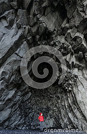 Amazing rocks in iceland and woman torist inside Stock Photo