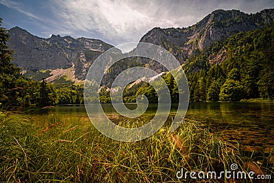 Amazing scenery under the huge mountains. Glaciers cover with snow and unique magical lake. Stock Photo