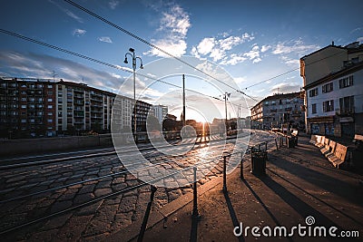 Amazing shot of cobblestone tramway rails and a sidewalk going along it Editorial Stock Photo