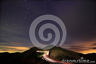 Amazing starry night accompany with meteor Stock Photo