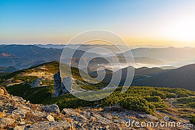 Amazing sunrise high in the mountains. Autumn morning at the mountain top Stock Photo