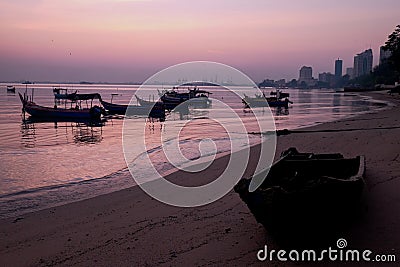 Amazing sunrise with silhouette image fishing boat view as a foreground.Nature composition:Ideal use for background Stock Photo