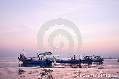 Amazing sunrise with silhouette image fishing boat view as a foreground.Nature composition:Ideal use for background Stock Photo