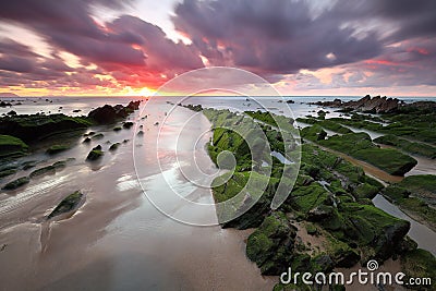 Amazing sunset over barrika beach Biscay, Basque Country scenary of Game of Thrones Stock Photo