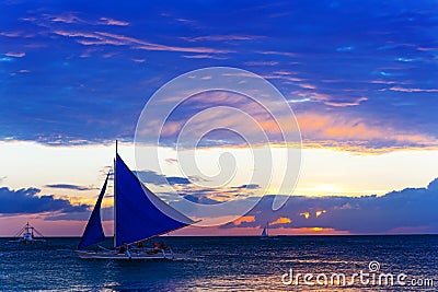 Amazing sunset at sea. Sailboat Editorial Stock Photo