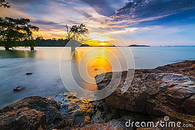 Amazing sunset at Tanjung Pinggir Beach Batam Island Stock Photo