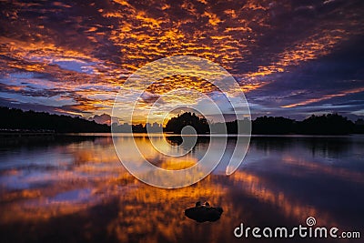 Amazing sunset view with dramatic sky at Wetland Lake Park Stock Photo