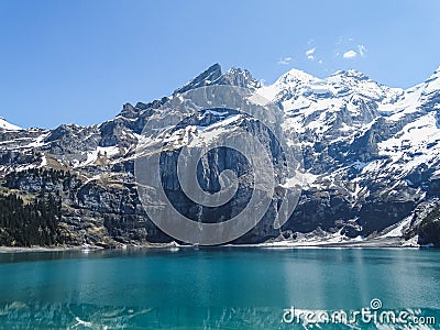 Amazing tourquise Oeschinnensee with Swiss Alps Kandersteg Stock Photo