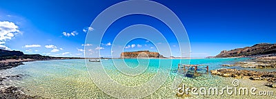 Amazing view of Balos Lagoon with magical turquoise waters, lagoons, tropical beaches of pure white sand and Gramvousa island. Stock Photo