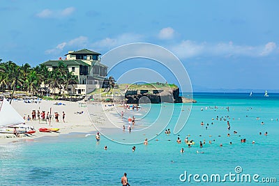 Amazing view of busy gorgeous Cuban beach with many people swimming in the ocean Editorial Stock Photo