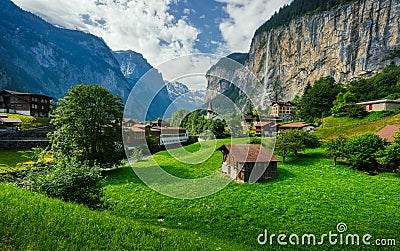 Amazing view of famous Lauterbrunnen town with beautiful Staubbach waterfalls in the background, Switzerland Stock Photo