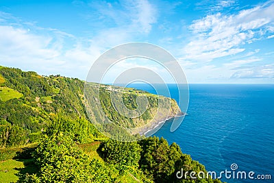 Amazing view of a green cliff near the sea in the Azores archipelago, Portugal Stock Photo