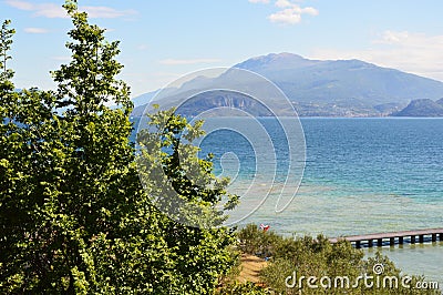 Amazing view of Lake Garda from the hills of the park Parco Pubblico Tomelleri in Sirmione town, Italy Stock Photo