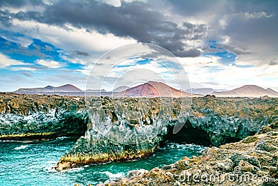 Amazing view of lava`s caves Los Hervideros and volcanoes in Lanzarote island, popular touristic attraction. Location: Lanzarote, Stock Photo