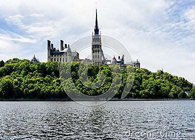 parliament hill surrounded by green forest ai Stock Photo