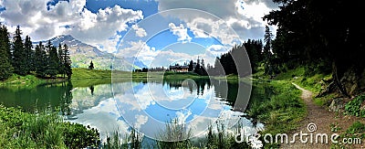 Amazing view of a small mountain lake, mirror effect Stock Photo