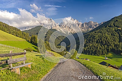 Amazing view of St. Magdalena village, Funes Valley Villnob with Odle Group mountains on background, Dolomiti Alps, Bolzano, Stock Photo