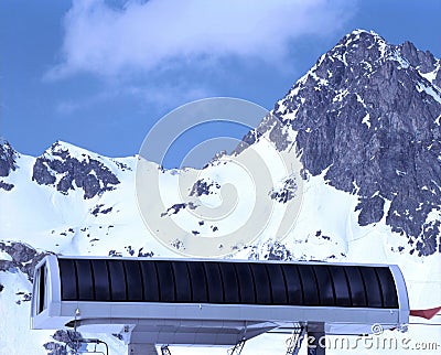 An amazing view of swiss alps and a ski lift and snowy mountains Stock Photo
