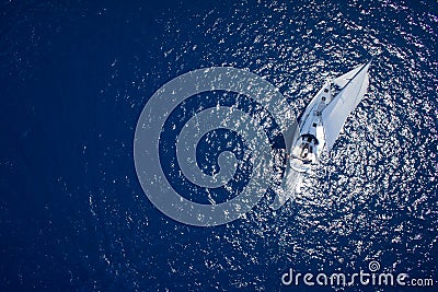 Amazing view to Yacht sailing in open sea at windy day. Drone view - birds eye angle Stock Photo