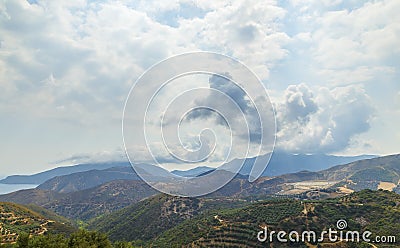 Amazing view from the top of a mountain down to the sea, close to Itea Stock Photo