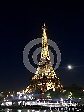 Eiffel Tower illuminated at night. Editorial Stock Photo