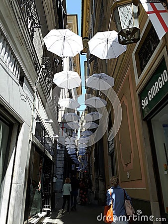 An amazing white umbrellas decoration over the city of Genova Editorial Stock Photo