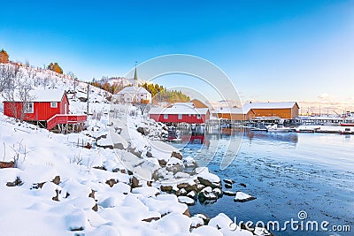 Amazing winter scenery of Moskenes village with ferryport and famous Moskenes parish Churc Stock Photo