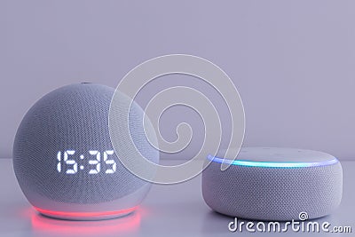 Voice controlled speaker with activated voice recognition, on light background Stock Photo