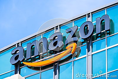 Amazon logo on the facade of one of their office buildings Editorial Stock Photo