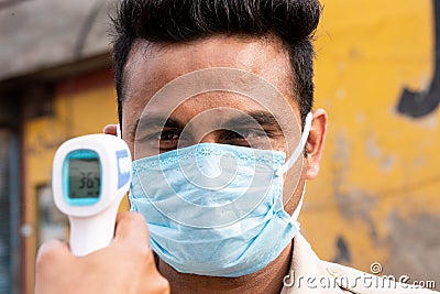 Ambala City, Haryana/India -04/30/2020 Health workers checking body temperature of police during Routine Checkup to avoid covid i Editorial Stock Photo