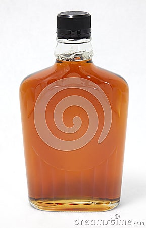 Amber Brown Bottle of Maple Syrup Stock Photo