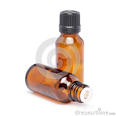 Amber color small glass bottle with pin hole dropper and black cap Stock Photo