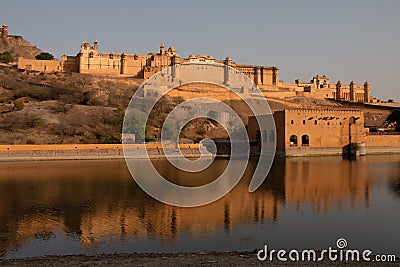 Amber Fort wth its large ramparts and series of gates and cobbled paths overlooking Maota Lake, Amer Stock Photo