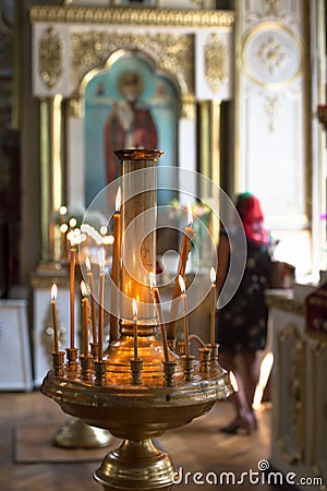 ambiance of church, candles and bokeh yellow lights Stock Photo