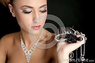 Ambition and greed in fashion woman with jewelry Stock Photo